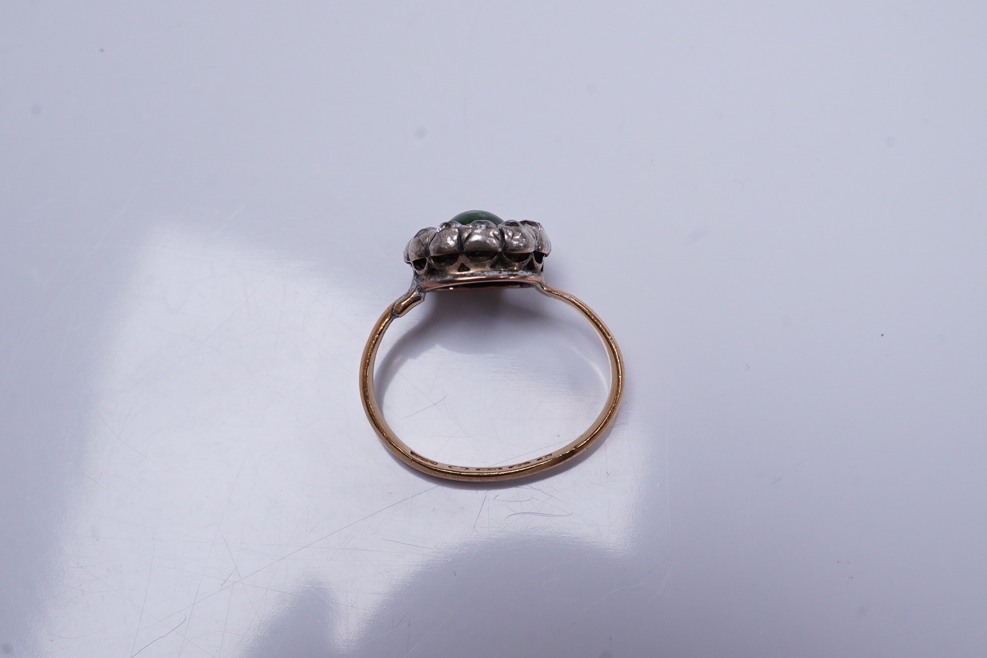 An Edwardian 22ct gold ring shank, with earlier? silver, gold, diamond and turquoise cluster set ring head(diamond missing), size J/K, gross weight 4.6 grams. Condition - poor